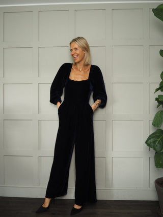 July Velvet Wide Leg Jumpsuit with Deep, Square Neckline Front &amp; Back, Long Sleeve with Frilly Detail by Frnch - Navy Blue